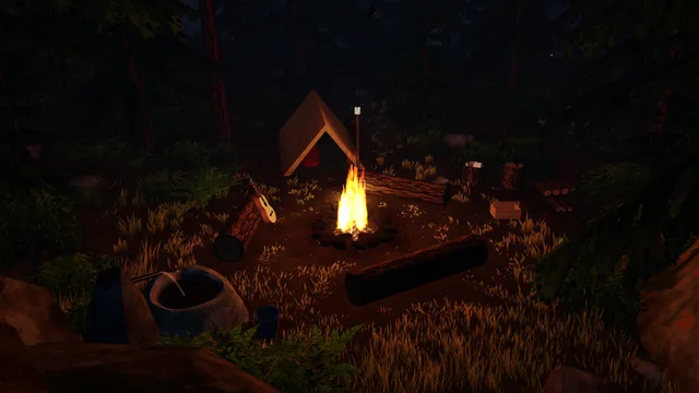 The camp from up on the rocks, the fire alight in its ring, the tent behind it.